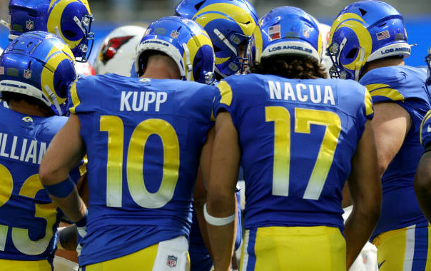 K. Williams/C. Kupp/P. Nacua in the huddle